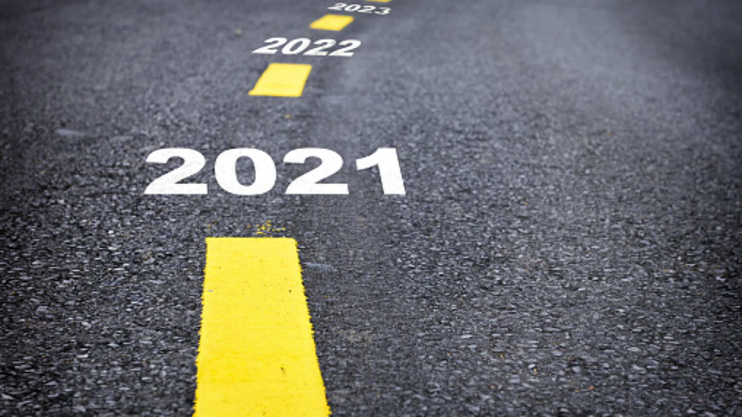 Number of 2021 to 2024 on asphalt road surface with marking lines